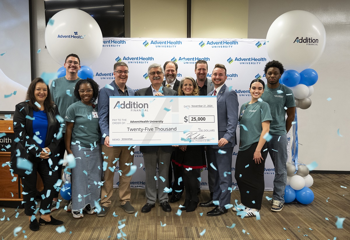 Students and leaders from AdventHealth University join with leaders from Addition Financial to celebrate their new collaboration.